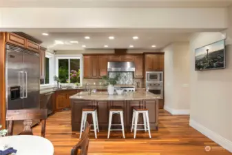 Spacious "chef's" kitchen with island and bar.