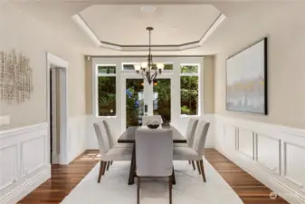 Formal dining room with French doors out to private patio with built in barbeque.