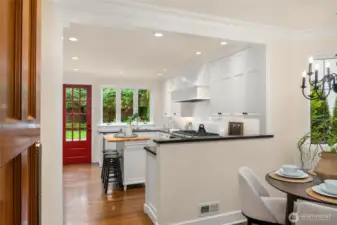 A swinging door leads you from the dining room into the breakfast nook & kitchen.