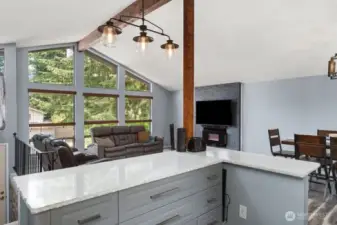 Open to the living  room and fireplace.