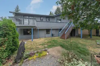 Stairs off deck to lower patio /garden & firepit