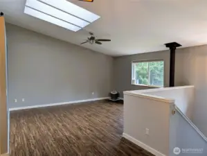 Large family room on upper floor with propane fireplace