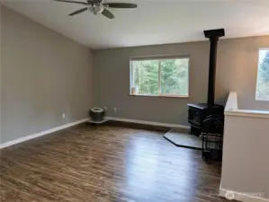 Large family room on upper floor with propane fireplace