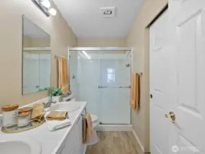 Double sink and walk-in shower and closet