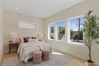 Abundant storage in a beautifully lit bedroom.