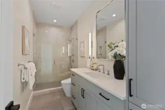 Elegant 3/4 bath serves the secondary bedrooms, featuring high end finishes, and a toto washlet.
