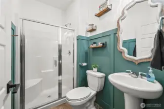Stylish half bath with unique vanity and accent wall – a perfect blend of function and design.