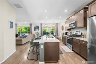 Open-concept kitchen layout with oversized island and pendant lighting, ideal for entertaining.