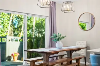 Dining area with large window overlooking the backyard, perfect for casual meals.