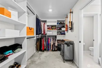 Expansive walk-in closet with custom shelving and ample storage space in the primary suite.