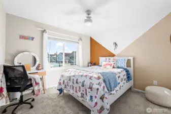 Additional bedroom with angled custom detail, creating a unique and cozy space.