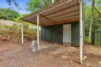 Two sheds provide excellent storage and workspace, ideal for hobbies, tools, or outdoor gear.