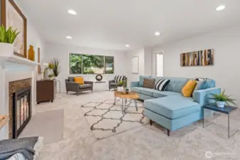 Just inside the front entry, this magnificent living room provides the cozy joy of a real wood burning fireplace!