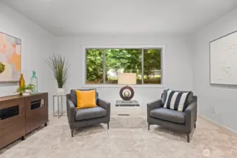 With windows on both sides, this living space offers delightful views of the lush green world outside.