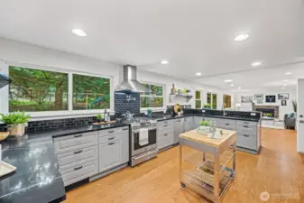 With big windows overlooking the back deck, patio, play set and grounds, this kitchen feels like home.