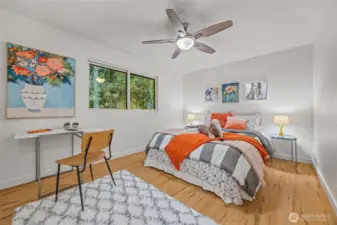 The third bedroom comes with a massive closet and sits quietly at the back of the house, overlooking the playset and lush forest.