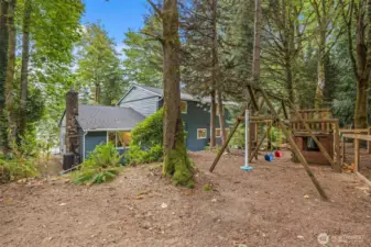 This part of the yard offers a lovely level space beyond the playset. It's perfect for a picnic area, giant trampoline, or anything else you've ever wanted to have!
