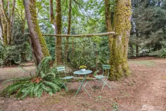 Just past the front of the house, this quiet reflection and relaxation area begs you to get outside more! Grab a book and a cup of tea and let the birds serenade you!