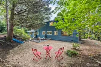 Beyond the back deck and patio, there's a large level area waiting for your vision and delight!