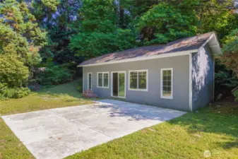 Additional non-conforming creekside studio with electricity.