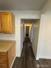 Hallway to Bedrooms 3 & 4, and the second full bathroom