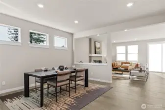 Bright dining room with defined space while staying connected to the great room and kitchen.
