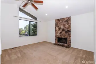 Lots of natural light with impressive rockery accenting the firewplace