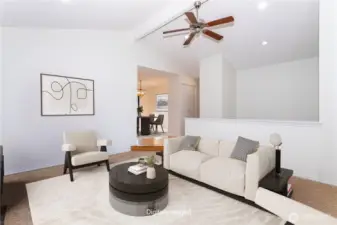 Virtually staged living room, looking into the dining area