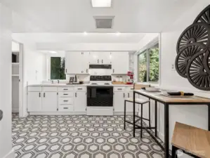 Updated lower level includes a second kitchen with a massive walk-in pantry.