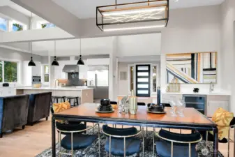 Main level formal dinning with wet bar & Fredrick Raymond LED Abstract Chandelier.