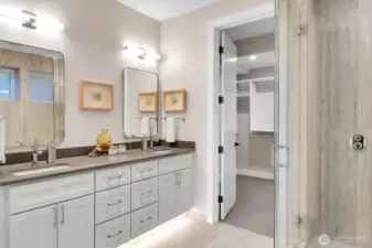 Lower level primary ensuite, quartz double sink vanity with light sensor floor lighting and walk-in closet.