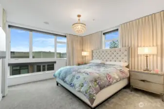 Sunny and bright primary suite. But for a restful sleep enjoy remote controlled blackout blinds.