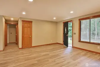 There is a coat closet at the entry...the front yard overlooks The Headlands community which consists of wooded acreage and waterfront acreage homes...there is a nice stand of evergreens across the street.