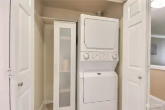 Laundry room with storage.