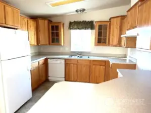 Kitchen with eating space adjoins dining room.