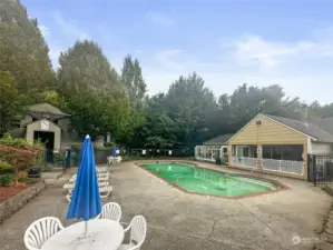 Large patio area surrounding pool