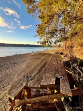 Rustic log platform with kayak storage underneath