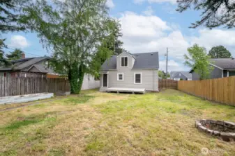 This spacious backyard provides plenty of room to play, relax, and garden.
