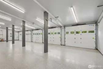 Featuring heated floors, 5 bays, a roll-up door, a car lift, and showroom-quality finishes—truly “Next Level.”