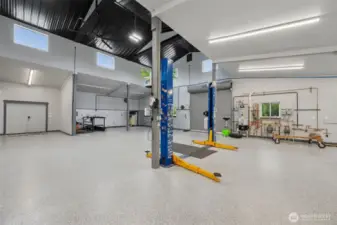 Featuring heated floors, 5 bays, a roll-up door, a car lift, and showroom-quality finishes—truly “Next Level.”