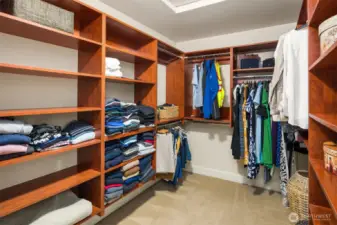 2nd floor primary bedroom walk-in closet with built-ins