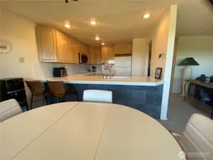From the dining area, looking back toward the hall and kitchen