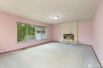 Large Living room with a wood fireplace. Gas is available.
