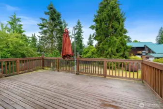 Spacious deck overlooking large back yard.