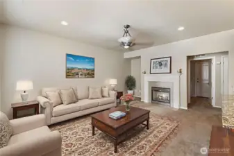 Large Family Room adjacent to the Kitchen. Gas fireplace adds charm and warmth. Virtually staged.