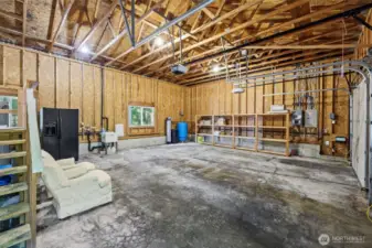 Huge garage with extra storage rack.