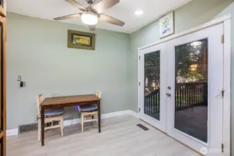 Kitchen eating space with access to the back deck.