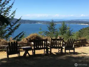 Views northerly looking over Eastsound Village and Sucia/Matia Islands, Canada beyond. This sitting area is located on the second lot where the covered bbq/picnic area is located.