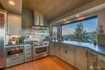 A favorite feature is the stove hood with infrared warming lights and warming shelf and just look at all that counter space. The views from the kitchen will take your breath away!