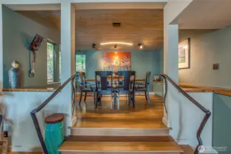 Elevated dining room with iron railing will reach out and welcome your taste buds.
